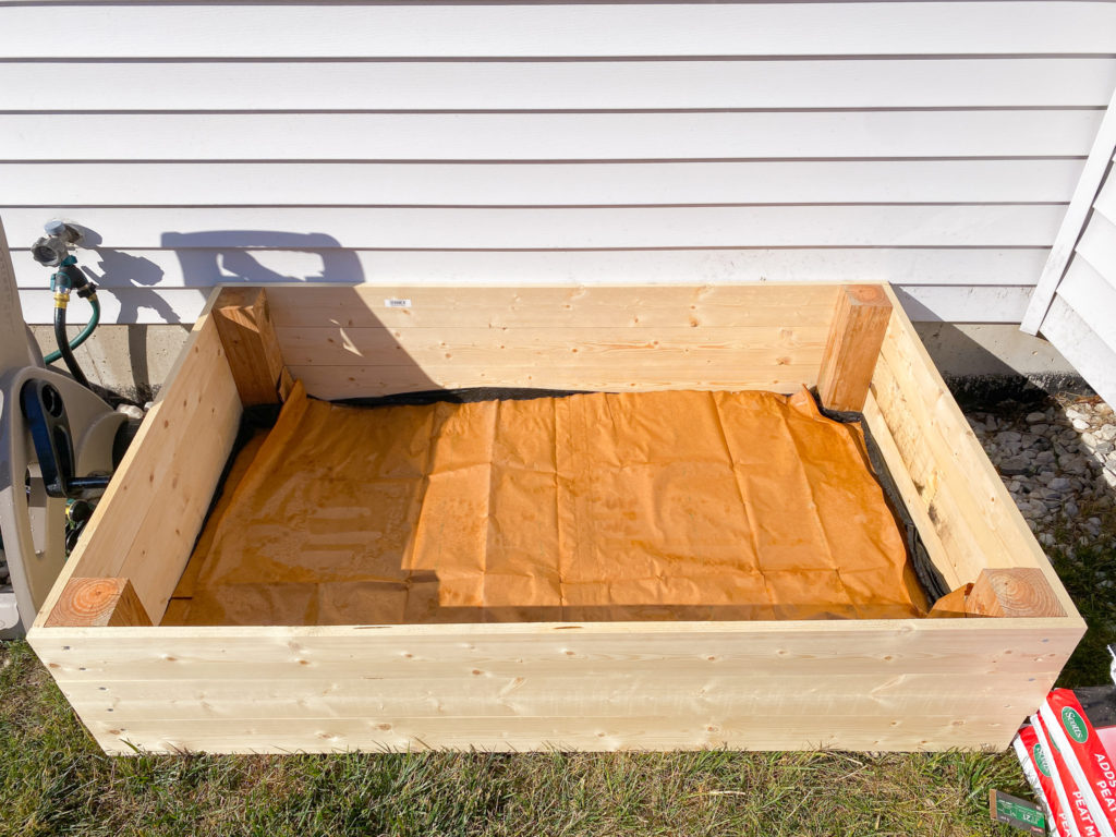 layering garden bed with brown paper bags and card board